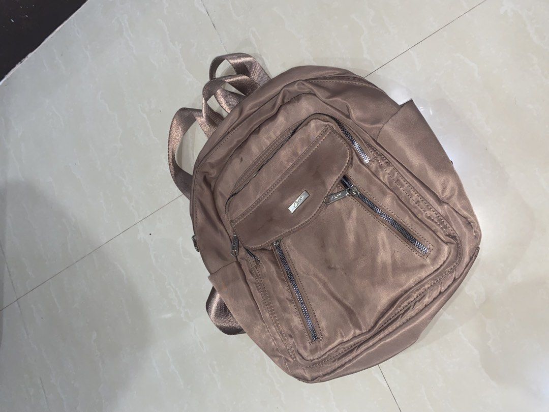 Preloved Cosè backpack (Category: Backpacks) located in Manila. Submitted by martinimnida (Listing ID 1467077153, Image 2). Description: Good condition inside and has a different compartments. But there are few stain. .