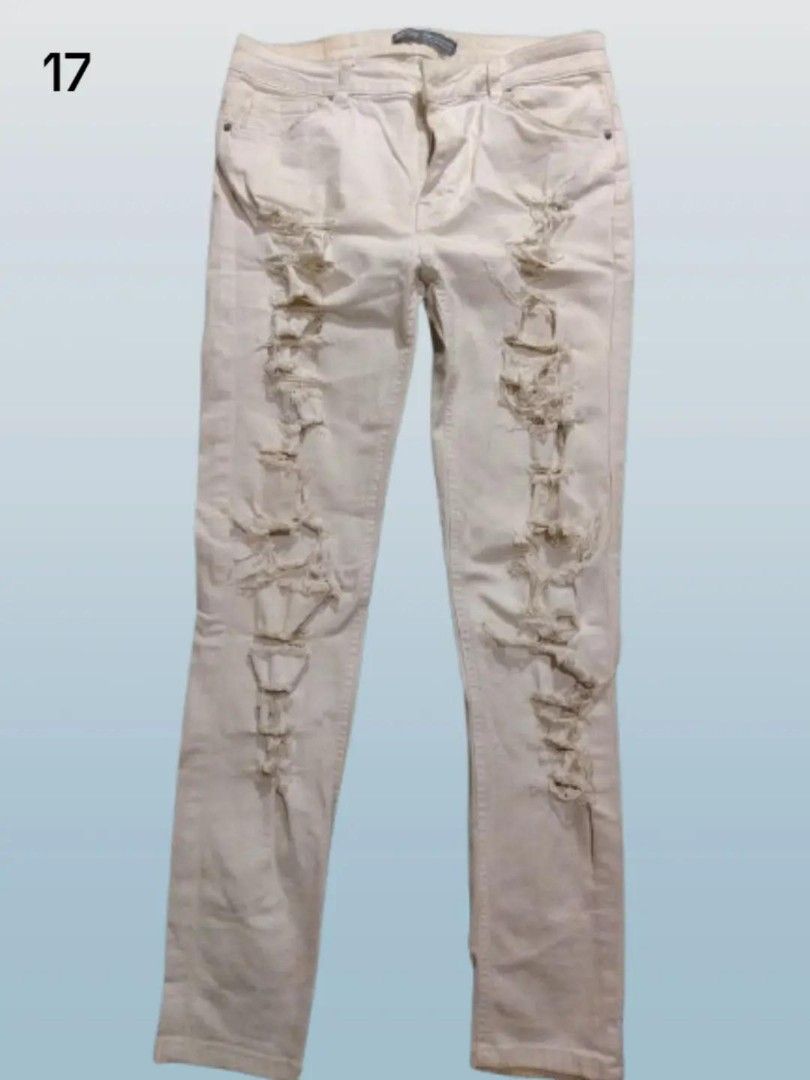 pre-loved off-white ripped jeans (Category: Jeans) located in Rizal. Submitted by thecycreatives (Listing ID 1466996798, Image 1). Description: - 100 - bershka - never used but matagal na naka stock sa maleta - issue: need i-wash - waist: 29 inches (flat measurement: 14.5 inches) - length: 94 cm details: Off-white/cream heavily ripped denim jeans with front shredding (makapal at medyo mabigat).