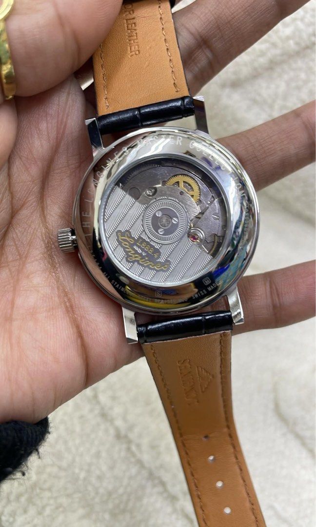 Preloved Watch Longines Master Collection Automatic Moonphase Watch (Category: Men's Watches) located in Manila. Submitted by bagsandmanymanymore1 (Listing ID 1466606559, Image 2). Description: - Brand/Model: Longines Master Collection Automatic -Size 40mm - Dial: Silver barleycorn with black Roman numerals, blued steel hands, and blue cabochon crown - Complications: Date and moonphase subdial at 6 o'clock - Movement: L899.4 automatic movement vi