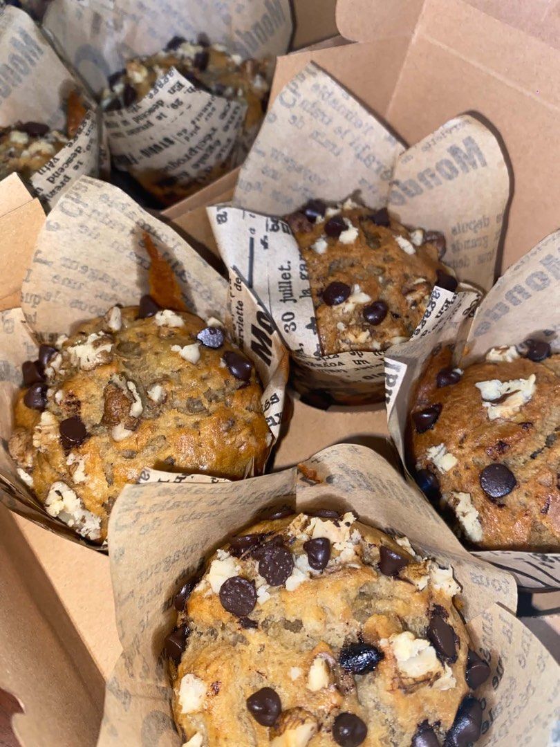PRE-ORDER Chocolate Banana Muffin (Category: Homemade Bakes) located in Manila. Submitted by akmerch (Listing ID 1467138966, Image 2). Description: Freshly baked banana muffin! - with dark chocolate chips - walnuts (can be removed if allergic) Banana muffin with dark chocolate chips and walnuts for added texture. ₱220 per box / 4pcs.