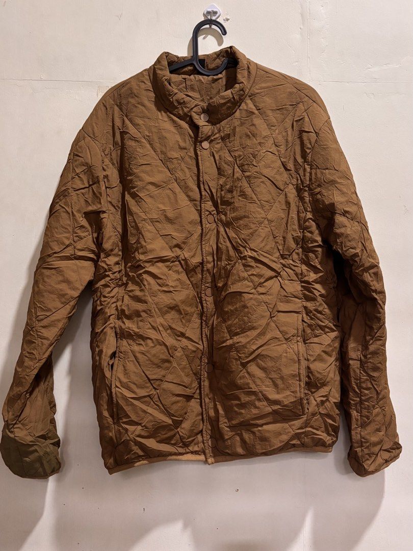 Puffer Jacket - Women’s XXL (Category: Coats, Jackets and Outerwear) located in Caloocan City. Submitted by ehannash (Listing ID 1466989241, Image 1). Description: - Color: Brown - Material: Quilted nylon (lightweight layer) - Size: XXL - Features: Stand-up collar, front snap button closure, two side pockets - Condition: Normal wear, great for cool weather, used onced winter in Korea .