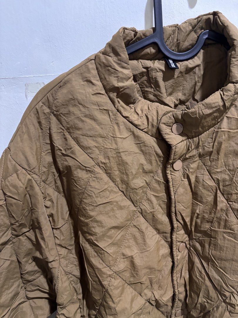 Puffer Jacket - Women’s XXL (Category: Coats, Jackets and Outerwear) located in Caloocan City. Submitted by ehannash (Listing ID 1466989241, Image 2). Description: - Color: Brown - Material: Quilted nylon (lightweight layer) - Size: XXL - Features: Stand-up collar, front snap button closure, two side pockets - Condition: Normal wear, great for cool weather, used onced winter in Korea .