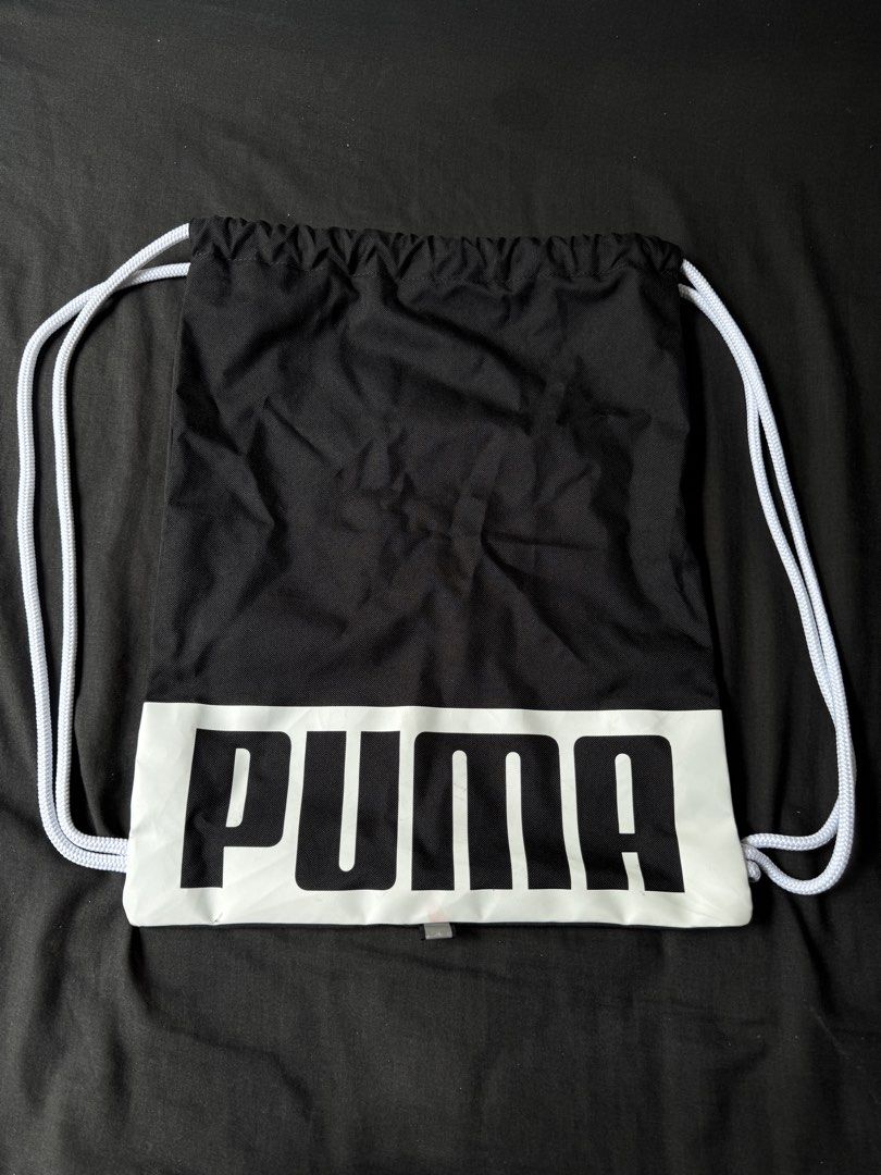 Puma Black and White Drawstring Bag Gym Sack (Category: Backpacks) located in Naga. Submitted by futurenostalgia (Listing ID 1467024616, Image 1). Description: - Brand: Puma - Color: Classic black with a large white logo panel - Closure: Easy-pull white drawstring cords on both sides - Material: Lightweight and easy to pack - Versatile: Great for workouts, school, and quick errands - Condition: Brand new / Excellent quality.