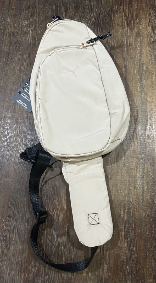 Puma Evercat Myriad Sling (Tag attached) (Category: Sling Bags) located in Paranaque City. Submitted by tinsj (Listing ID 1467052903, Image 1). Description: The item is brand new with the original tag still attached. There are two very tiny stains at the back, which are barely noticeable and covered when worn (see last 2 photos for reference..