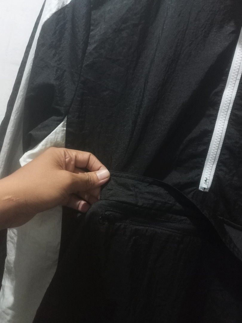 Puma Suede Windbreaker Size medium to large (Category: Coats, Jackets and Outerwear) located in Taguig. Submitted by mvdsh0p2022 (Listing ID 1467082039, Image 2). Description: - Brand: Puma - Item: Suede Windbreaker Jacket - Color: Black and White - Size: Medium (M)to large - Style Number: 574979-01 - Features: Gold foil Puma logo, custom 'SUEDE' metal zipper pull - Pockets: Front kangaroo pocket with secure zipper closure - Interior: Comfortable
