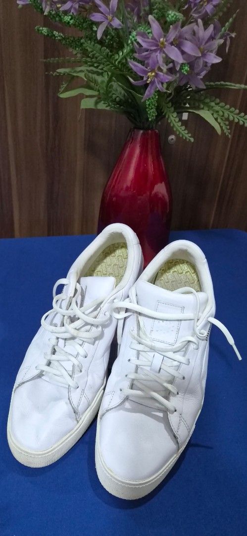 Puma GOLF White Leather Sneakers Size US 11 (Category: Sneakers) located in Manila. Submitted by pixiedachi (Listing ID 1467020716, Image 1). Description: - Brand: Puma Golf Shoes - Color: White with yellow insoles spikeless GOLF shoes - Style: Minimalist lace-up leather sneakers with classic heel cat logo - Size: 11 US / 44.5 EUR - Material: Premium leather upper with textured hexagonal rubber outsole - Condition: Light scuffing on soles from no