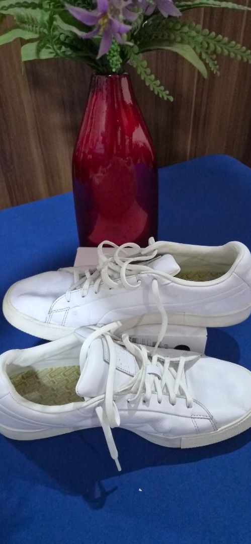 Puma GOLF White Leather Sneakers Size US 11 (Category: Sneakers) located in Manila. Submitted by pixiedachi (Listing ID 1467020716, Image 2). Description: - Brand: Puma Golf Shoes - Color: White with yellow insoles spikeless GOLF shoes - Style: Minimalist lace-up leather sneakers with classic heel cat logo - Size: 11 US / 44.5 EUR - Material: Premium leather upper with textured hexagonal rubber outsole - Condition: Light scuffing on soles from no