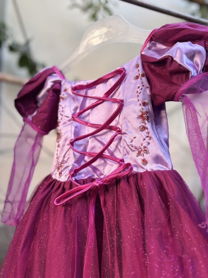 Rapunzel Costume 6-7 yo (Category: Babies & Kids Fashion) located in Catarman. Submitted by hyukissco (Listing ID 1467012153, Image 3). Description: Once used - English Month Gown-like. Slightly nego.