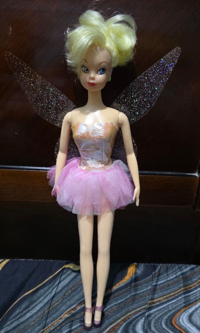 Rare Vintage Simba Disney Tinkerbell doll (Category: Kids Toys) located in Pasig City. Submitted by thoyz_boulevard (Listing ID 1467140522, Image 1). Description: No issues No cracked neck No bite marks No paint chip Rubber legs (bendable) Wings are attached to the dress.