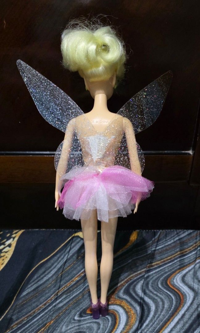 Rare Vintage Simba Disney Tinkerbell doll (Category: Kids Toys) located in Pasig City. Submitted by thoyz_boulevard (Listing ID 1467140522, Image 2). Description: No issues No cracked neck No bite marks No paint chip Rubber legs (bendable) Wings are attached to the dress.