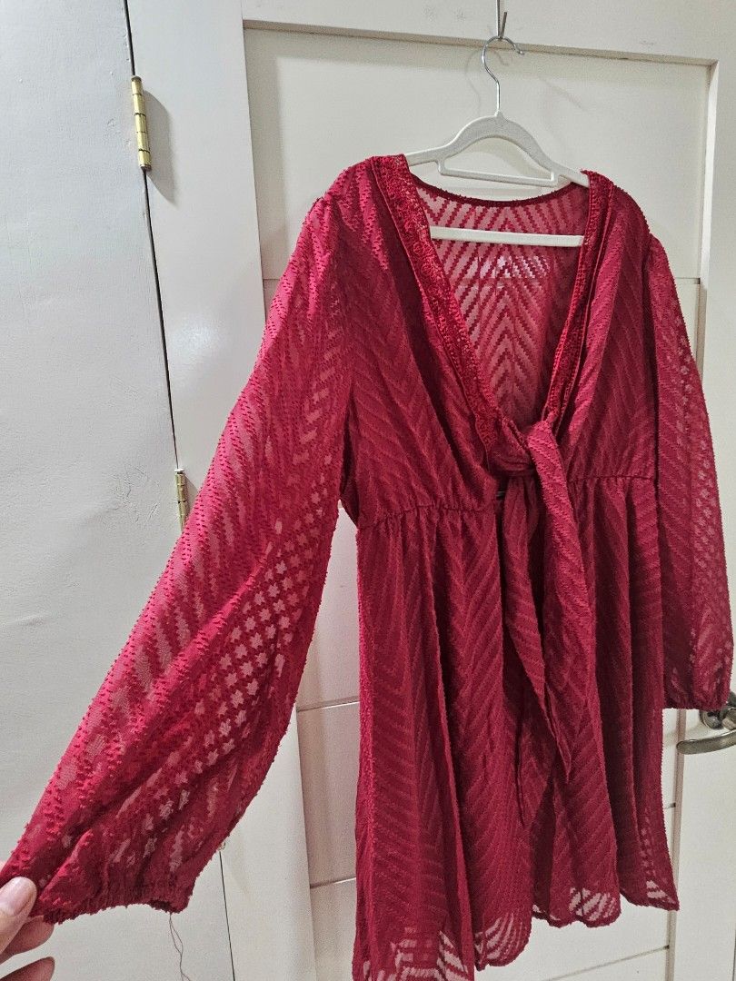 Red chevron patterned long sleeve tie front blouse (Category: Longsleeves) located in Santo Tomas. Submitted by buybugs (Listing ID 1467132259, Image 2). Description: - Red sheer fabric with chevron texture - Long sleeves with elastic cuffs - V-neckline with delicate lace trim - Tie-front detail and flared ruffled hem - Lightweight, easy to layer over a camisole - Buyer will cover the shipping fee: Flash| J&T | LBC - MOP: GCash, Maya, Bank Transf