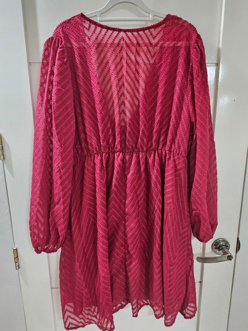 Red chevron patterned long sleeve tie front blouse (Category: Longsleeves) located in Santo Tomas. Submitted by buybugs (Listing ID 1467132259, Image 3). Description: - Red sheer fabric with chevron texture - Long sleeves with elastic cuffs - V-neckline with delicate lace trim - Tie-front detail and flared ruffled hem - Lightweight, easy to layer over a camisole - Buyer will cover the shipping fee: Flash| J&T | LBC - MOP: GCash, Maya, Bank Transf
