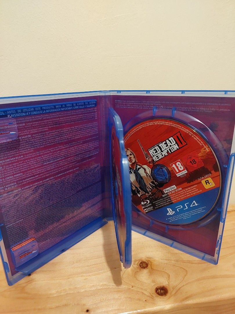 Red Dead Redemption 2 PS4 Game (Category: PlayStation) located in Cainta. Submitted by mike369369 (Listing ID 1467110354, Image 2). Description: - Platform: PlayStation 4 (PS4) - Condition: Complete with original blue case and artwork - Discs: 2 discs, 100% clean and scratch-free - Rating: PEGI 18 - Genre: Action-adventure masterpiece by Rockstar Games - Status: Tested and ready to play.