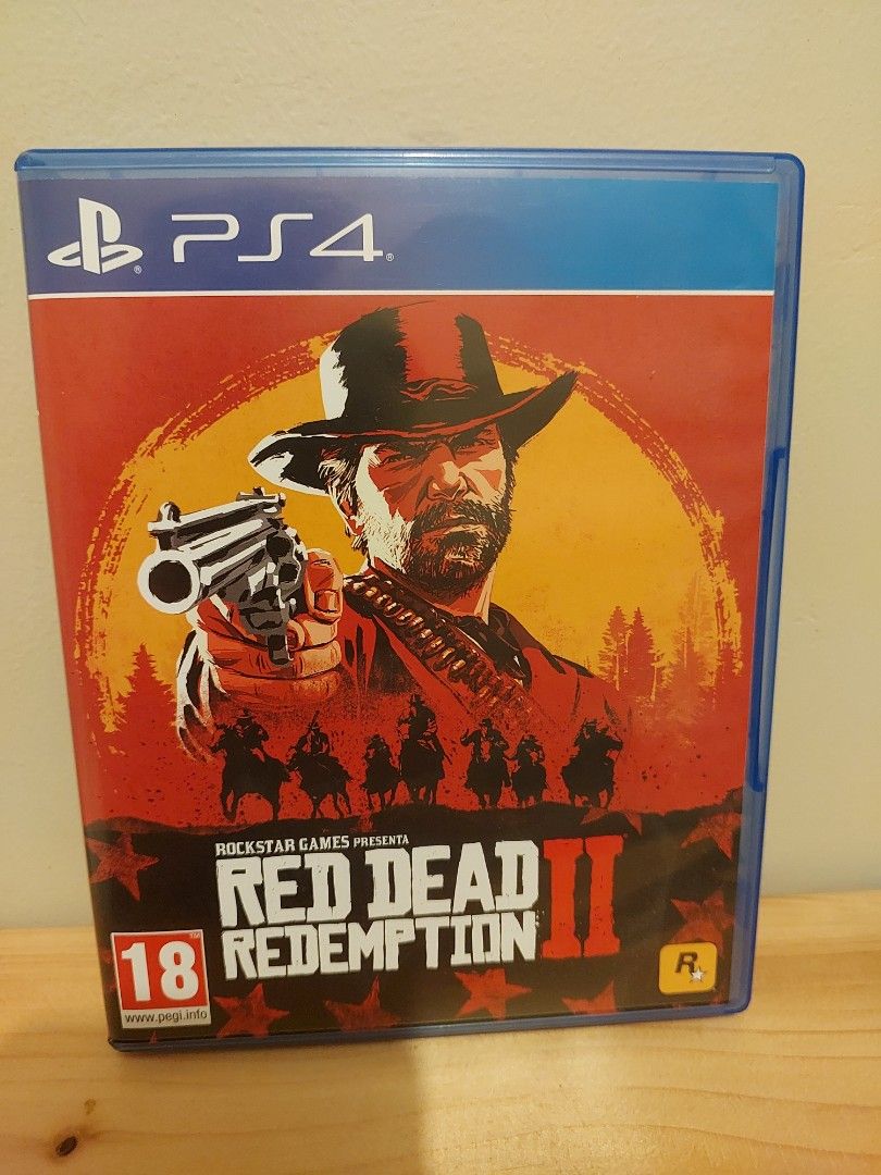 Red Dead Redemption 2 PS4 Game (Category: PlayStation) located in Cainta. Submitted by mike369369 (Listing ID 1467110354, Image 1). Description: - Platform: PlayStation 4 (PS4) - Condition: Complete with original blue case and artwork - Discs: 2 discs, 100% clean and scratch-free - Rating: PEGI 18 - Genre: Action-adventure masterpiece by Rockstar Games - Status: Tested and ready to play.
