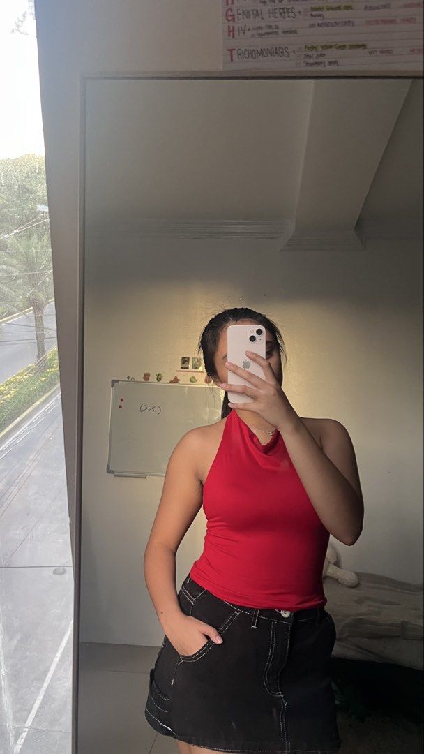 Red halter top sleeveless cowl neck (Category: Sleeveless) located in Manila. Submitted by iayo.15 (Listing ID 1467071314, Image 1). Description: - Color: Bright red - Style: Halter top with a chic cowl neckline - Fit: Fitted silhouette with comfortable, stretchy fabric - Versatility: Ideal for casual day outs or layering - Styling tip: Pairs perfectly with black skirts or denim.