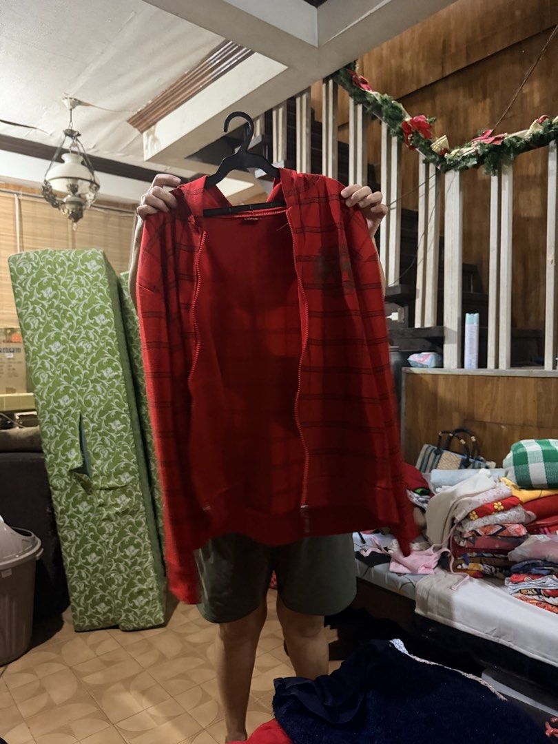 Red patterned zip-up hoodie with hood (Category: Hoodies) located in Quezon City. Submitted by BAYMAX72 (Listing ID 1466995999, Image 1). Description: - Color: Red with dark stripe pattern - Style: Long sleeves, front zipper closure - Fit: Relaxed and comfortable - Material: Soft, easy-to-wear everyday fabric - Condition: Excellent pre-loved/new (ready to ship).