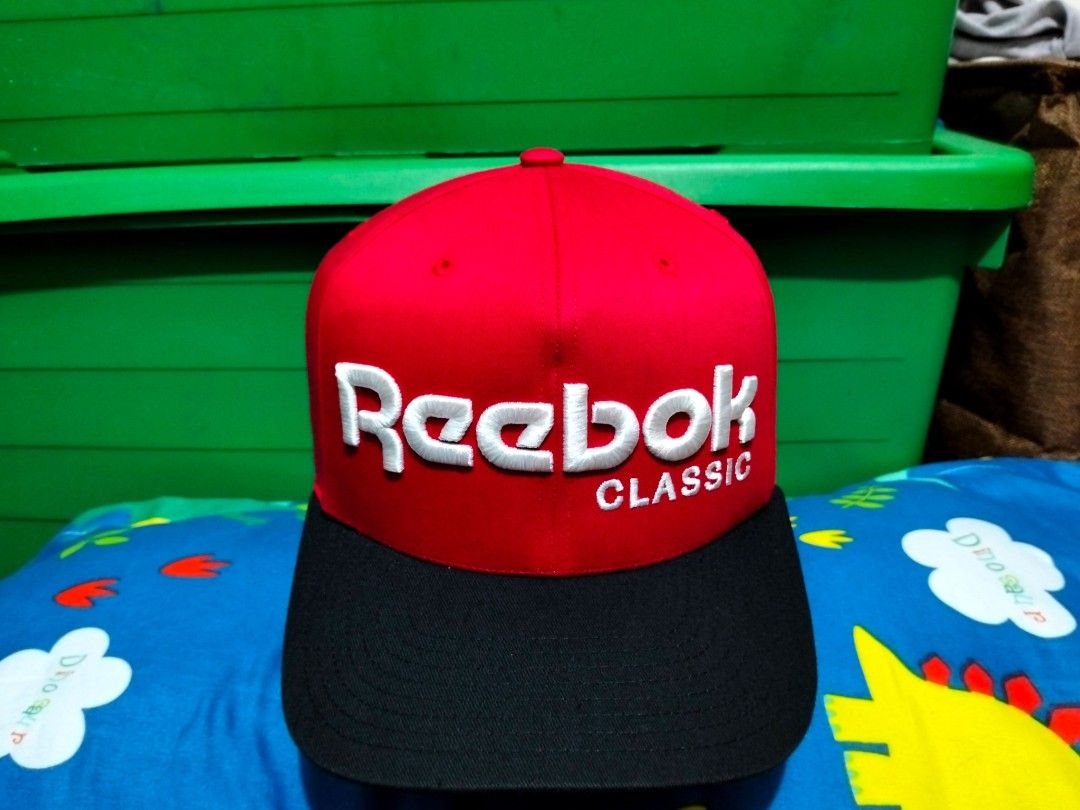 Reebok Classic Snapback Cap Red Black (Category: Caps & Hats) located in San Mateo. Submitted by JmThriftCap_Ph (Listing ID 1467113433, Image 1). Description: - Brand: Reebok Classic - Color: Bold Red and Black - Size: M-58 (Adjustable plastic snap closure) - Design: Large embroidered logo on front with 'R' detail on the back strap - Origin: Made in China.