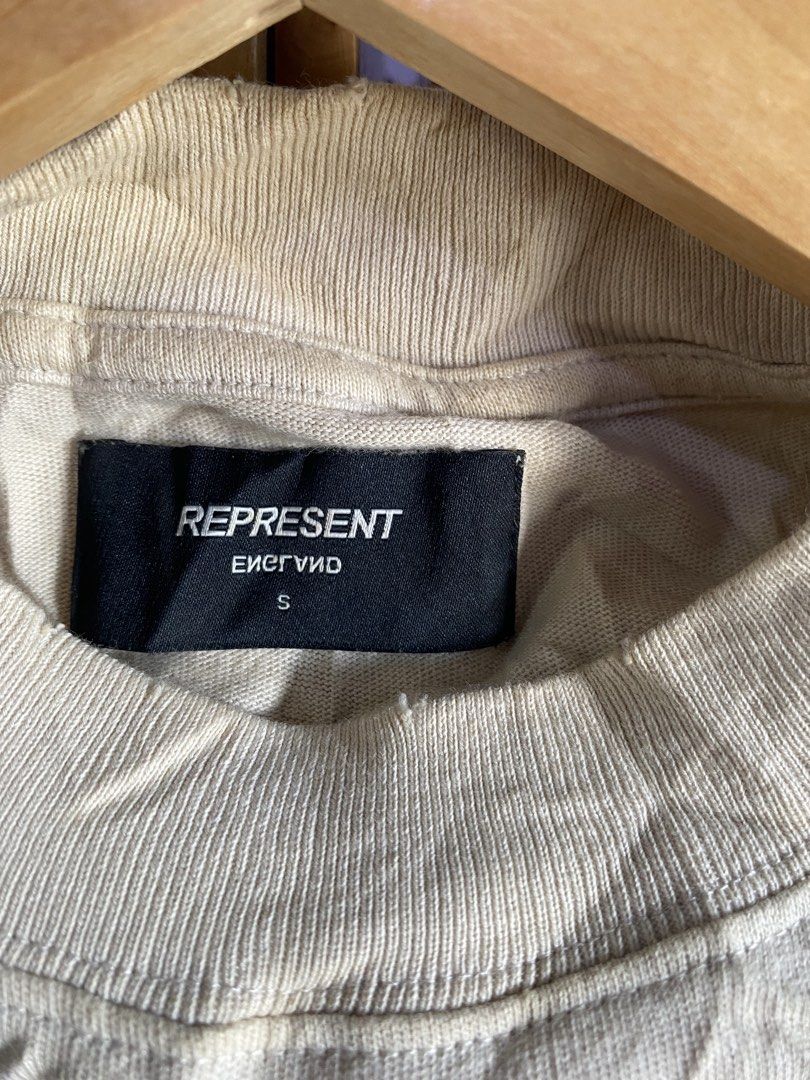 Represent (Category: Activewear) located in Kalibo. Submitted by rvna23 (Listing ID 1467125248, Image 3). Description: This is a cream-colored Represent Clo. "Rep N' Resent" UK Tour 1987 t-shirt, which parodies the iconic 1987 tour design of the rock band Guns N' Roses. Dimes : 21/31 size on tag SMALL Excellent Cond.