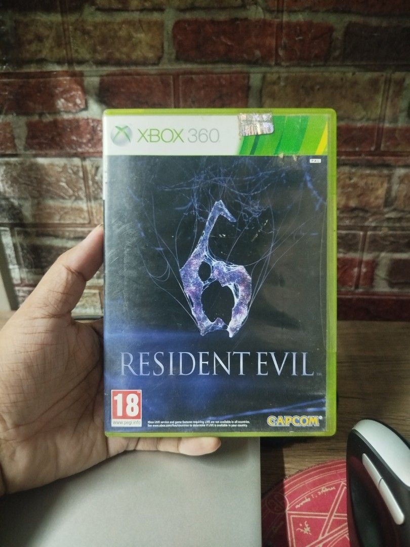 Resident Evil 6 Xbox 360 Game (Category: Xbox) located in Binan City. Submitted by pumpkiiin02 (Listing ID 1467040846, Image 1). Description: - Title: Resident Evil 6 - Platform: Xbox 360 (PAL Region) - Condition: Tested and working game disc - Includes: Original green plastic case, cover art insert, instruction manual booklet, and Disc 1 - Genre: Survival horror action shooter - Modes: Play solo or cooperative multiplayer.