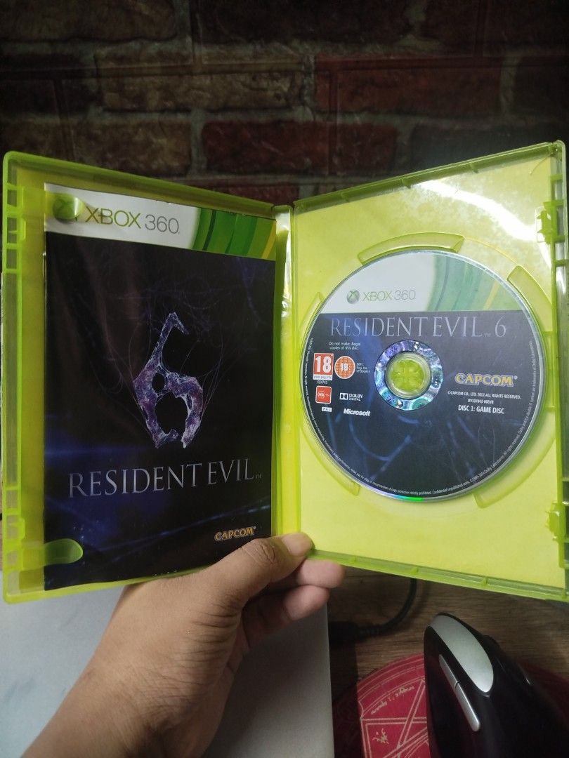 Resident Evil 6 Xbox 360 Game (Category: Xbox) located in Binan City. Submitted by pumpkiiin02 (Listing ID 1467040846, Image 3). Description: - Title: Resident Evil 6 - Platform: Xbox 360 (PAL Region) - Condition: Tested and working game disc - Includes: Original green plastic case, cover art insert, instruction manual booklet, and Disc 1 - Genre: Survival horror action shooter - Modes: Play solo or cooperative multiplayer.