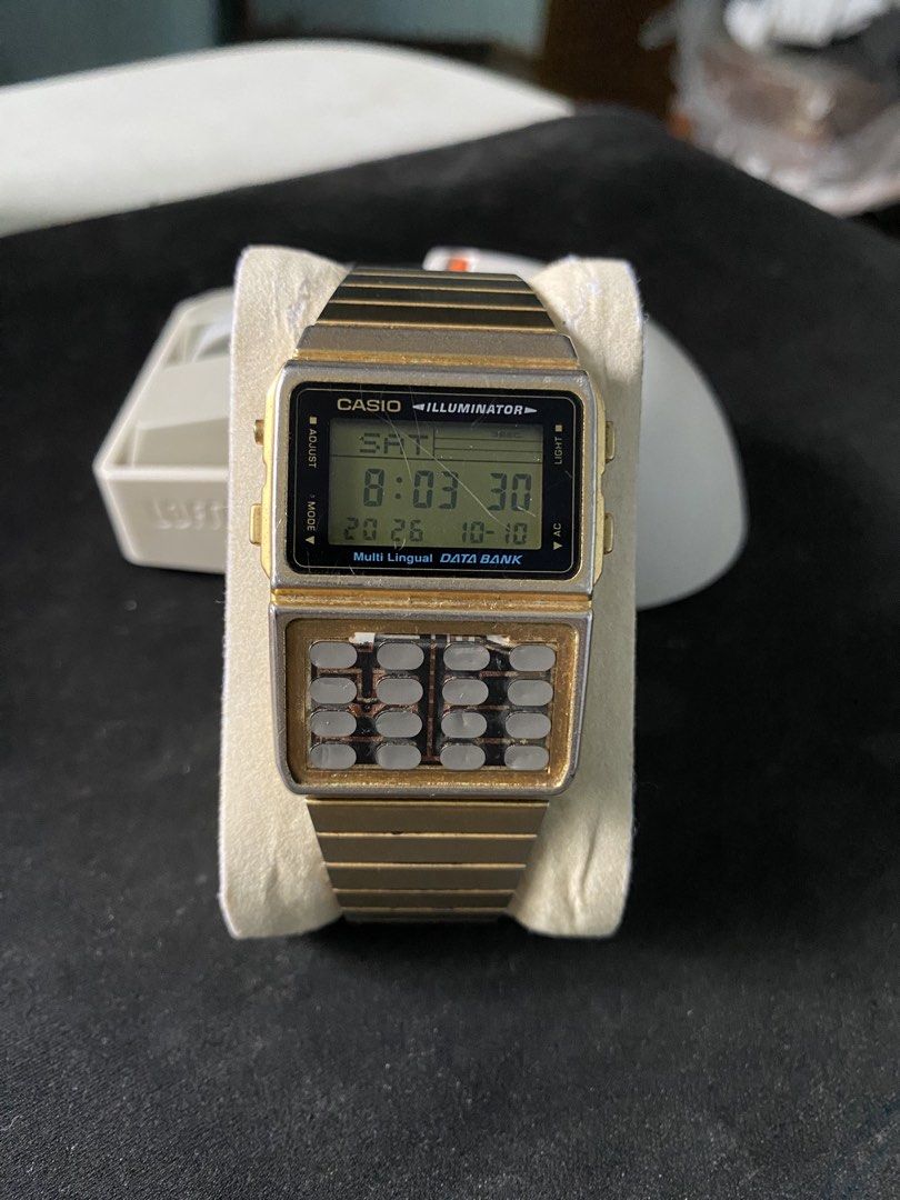 Retro Casio DBC-611G Gold Digital Watch Calculator (Category: Men's Watches) located in Lucena. Submitted by Spooony.vtg (Listing ID 1440136143, Image 1). Description: - Gold-tone Casio digital watch - Metal band - Illuminator for easy viewing - Built-in calculator - Dual time function - Displays day, date, and time ISSUE: Calc Pad stripped but all working.