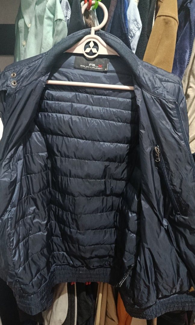 RLX puffer jacket Ralph Lauren x (Category: Coats, Jackets and Outerwear) located in Jaen. Submitted by vinzyrus217291 (Listing ID 1466992548, Image 3). Description: - 20.5x26 - 20.5 width 26 length - black and dark blue in color - dual front zip with snap button - 4 outer pockets 1 secret pocket - with tags issue: may sign of usage sa cuff snap buttons and may brown na nadikit sa loob Nueva ecija location 📍 can do meetups or shipping via jnt RL