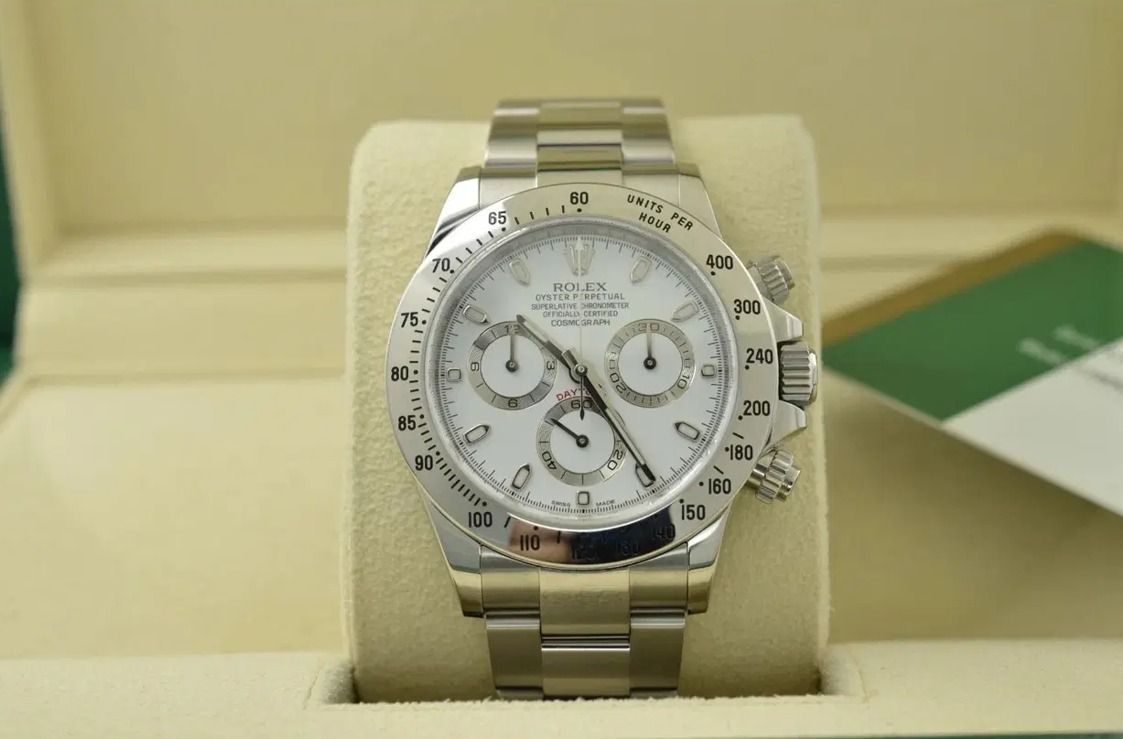 Rolex Cosmograph Daytona White Dial Watch 116520, APH (Category: Watches) located in Singapore. Submitted by david921 (Listing ID 1467155074, Image 1). Description: - Model: Rolex Cosmograph Daytona - Dial: Classic white with three sub-dials - Material: Stainless steel case and oyster bracelet - Bezel: Tachymeter scaled up to 400 units/hour - Inclusions: Original presentation box and official paperwork included - Condition: Pristine, well-maintai