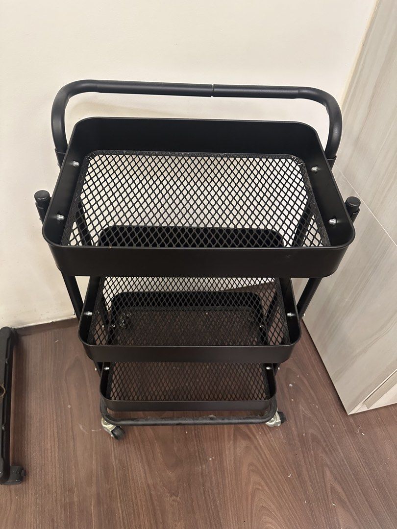 Rolling Trolley (Category: Storage Boxes & Baskets) located in Quezon City. Submitted by bqchane (Listing ID 1467095634, Image 2). Description: - Color: Sleek matte black - 3 spacious mesh baskets for ample storage - Sturdy metal frame construction for durability - Smooth-rolling wheels for effortless mobility - Convenient top handle for easy steering - Compact design fits perfectly in kitchens, offices, or bathrooms.