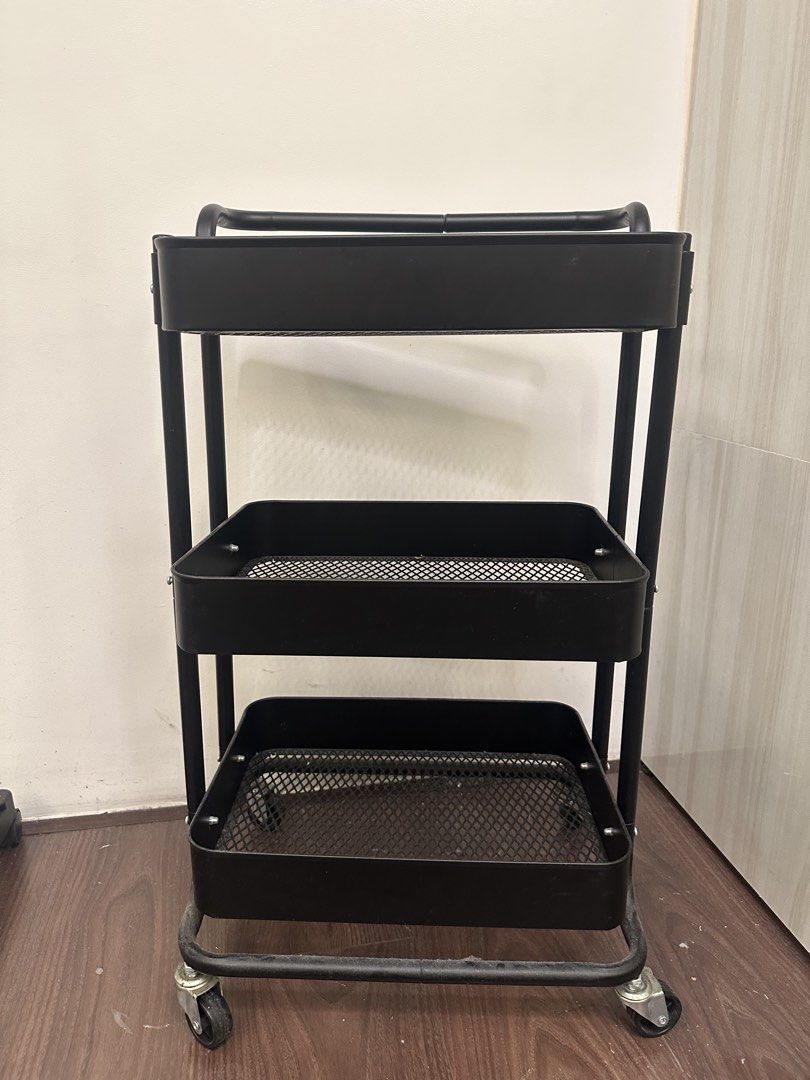 Rolling Trolley (Category: Storage Boxes & Baskets) located in Quezon City. Submitted by bqchane (Listing ID 1467095634, Image 1). Description: - Color: Sleek matte black - 3 spacious mesh baskets for ample storage - Sturdy metal frame construction for durability - Smooth-rolling wheels for effortless mobility - Convenient top handle for easy steering - Compact design fits perfectly in kitchens, offices, or bathrooms.