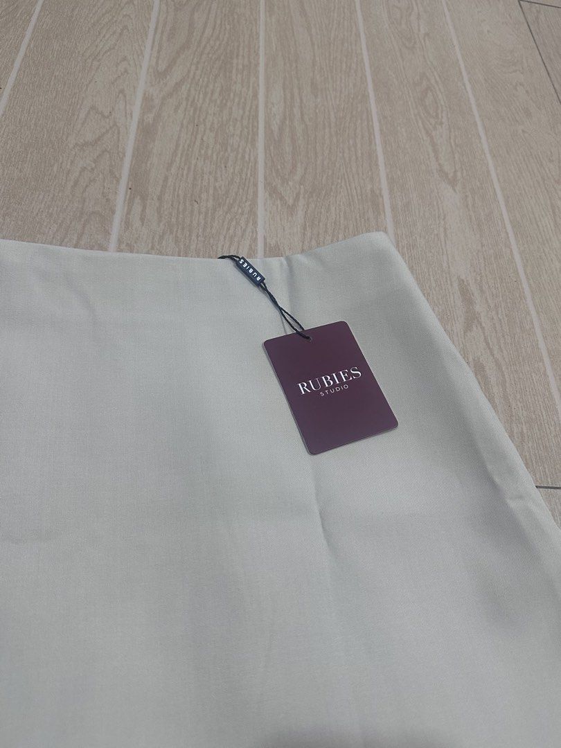 Rubies Moji Skirt (Category: Skirts) located in Manila. Submitted by lianne_a (Listing ID 1467007072, Image 2). Description: - Brand: Rubies - Condition: Brand new with tags (BNWT), never worn - Color: beige - Closure: Convenient side zipper with inner shorts - best fits size 26 Rfs: Wrong color from pasabuy Originally bought it for ₱1.4k Message me if interested. Delivery c/o buyer.