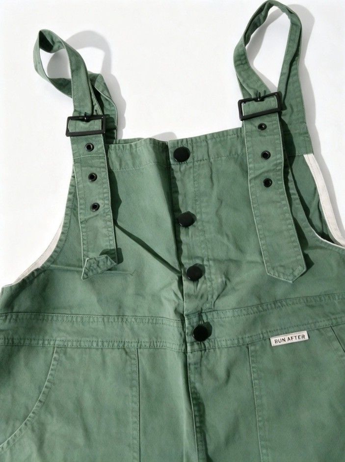 Run After Green Distressed Short Overalls (Category: Jumpsuits) located in Manila. Submitted by swiftdolphin_f17535 (Listing ID 1467036640, Image 3). Description: - Brand: Run After - Color: Sage green - Material: Comfortable cotton - Features: Adjustable buckle straps, front buttons, and rolled cuffs - Details: Distressed rips on pockets, deep front pockets, and chest brand patch - Style: Casual and perfect for warmer days.