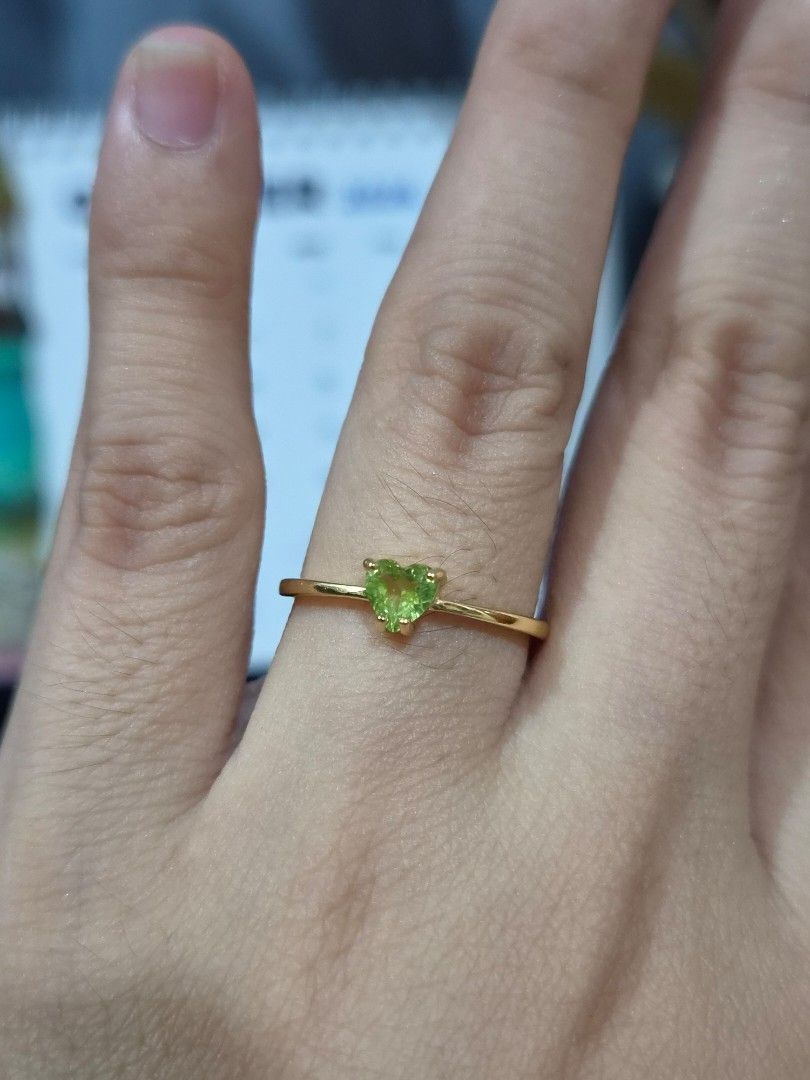 S925 Gold Plated Setting Peridot Ring (Category: Rings) located in Manila. Submitted by fayiefar (Listing ID 1467097930, Image 2). Description: - Material: Gold-plated S925 sterling silver - Gemstone: Vibrant green heart-cut peridot - Fit: Adjustable band fits most finger sizes - Style: Simple and dainty - Includes: Authentication certificate card.