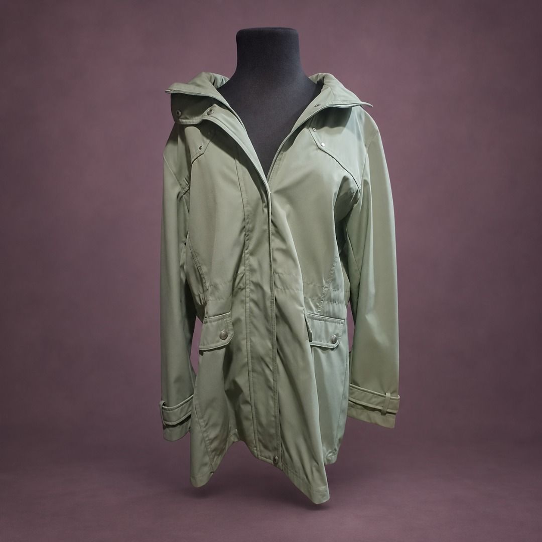 Sage Green Hooded Raincoat Jacket with Pockets (Category: Coats, Jackets and Outerwear) located in Muntinlupa City. Submitted by kaelakuneho (Listing ID 1467017538, Image 1). Description: - Color: Trendy sage green - Material: Lightweight and comfortable for all-day wear - Closure: Front snap buttons with high wind-blocking collar -Two functional front pockets with button flaps - Details: Button strap cuffs and a protective hood - Style: Simple, 