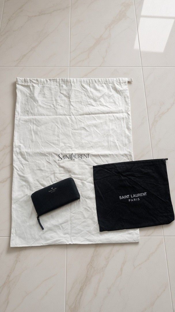 Saint Laurent dust bags (Category: Luxury Accessories) located in Cabadbaran. Submitted by lioness_cave (Listing ID 1467131596, Image 1). Description: wallet is for reference only not included Two Saint Laurent dust bags (1 white with Italian tags and recycling symbols, 1 black with silver Saint Laurent Paris text) 1 large size can fit large bag/ backpack 1 small size for small bags - Shipping or meetups available across the Philippines - PM for 