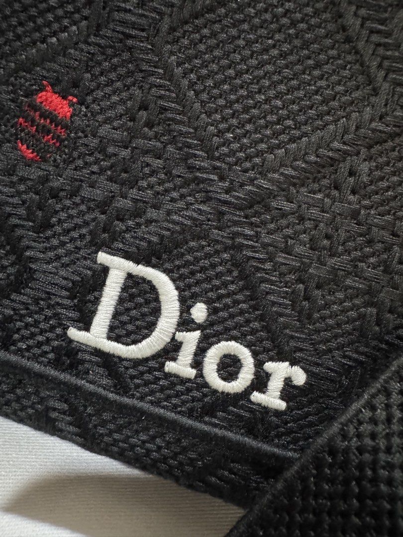 [RUSH SALE] Dior Book Tote with Strap - Small (Category: Tote Bags) located in Cebu City. Submitted by toteladyph (Listing ID 1466993877, Image 3). Description: **Good Quality - coded** Classic and elegant Dior Small Book Tote in black embroidered canvas, featuring the iconic Dior lettering on the front and signature quilted-style motif. Comes with top handles, a detachable shoulder strap, and silver-tone hardware. Details: * Brand: Christian Dio