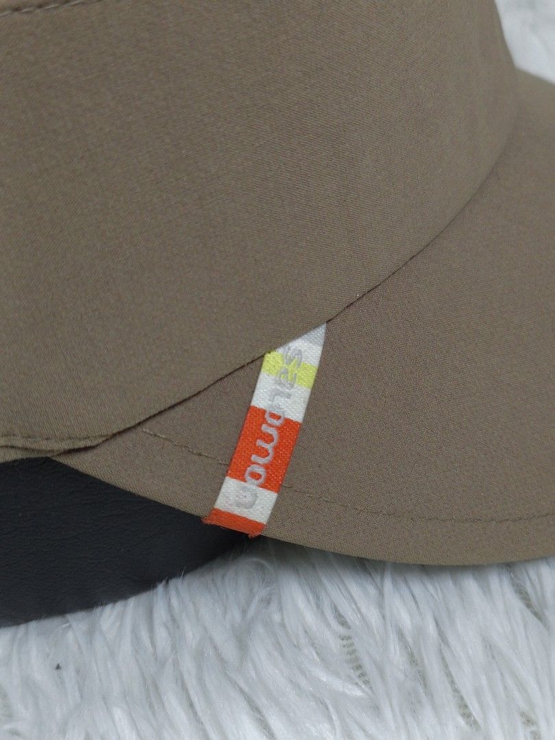 Salomon Brown Cadet Cap Army Hat (Category: Hats & Beanies) located in Imus. Submitted by grindhouse.thriftshop (Listing ID 1467061142, Image 3). Description: - Brand: Salomon - Style: Brown cadet hat with a flat top and curved brim - Details: Small color-blocked logo tag on the side, structured crown with stitching - Fit: Adjustable metal buckle strap at the back for a custom fit - Color: Neutral earth tone, perfect for casual outdoor outfits.