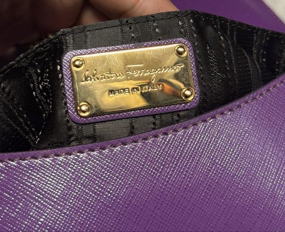 Salvatorre Ferragammo (Category: Luxury Bags & Wallets) located in Legazpi City. Submitted by thesource052 (Listing ID 1467163692, Image 3). Description: Salvatore Ferragamo Purple Leather Gancini Flap Bag Shoulder Bag / Kili bag Almost new With authenticity card Grape Srp before : 8900 HKD. Around 72k php price before Price now for only 8k only FREESHIP VIA JNT OR LBC Free HERMES ORIG DUSTBAG. .