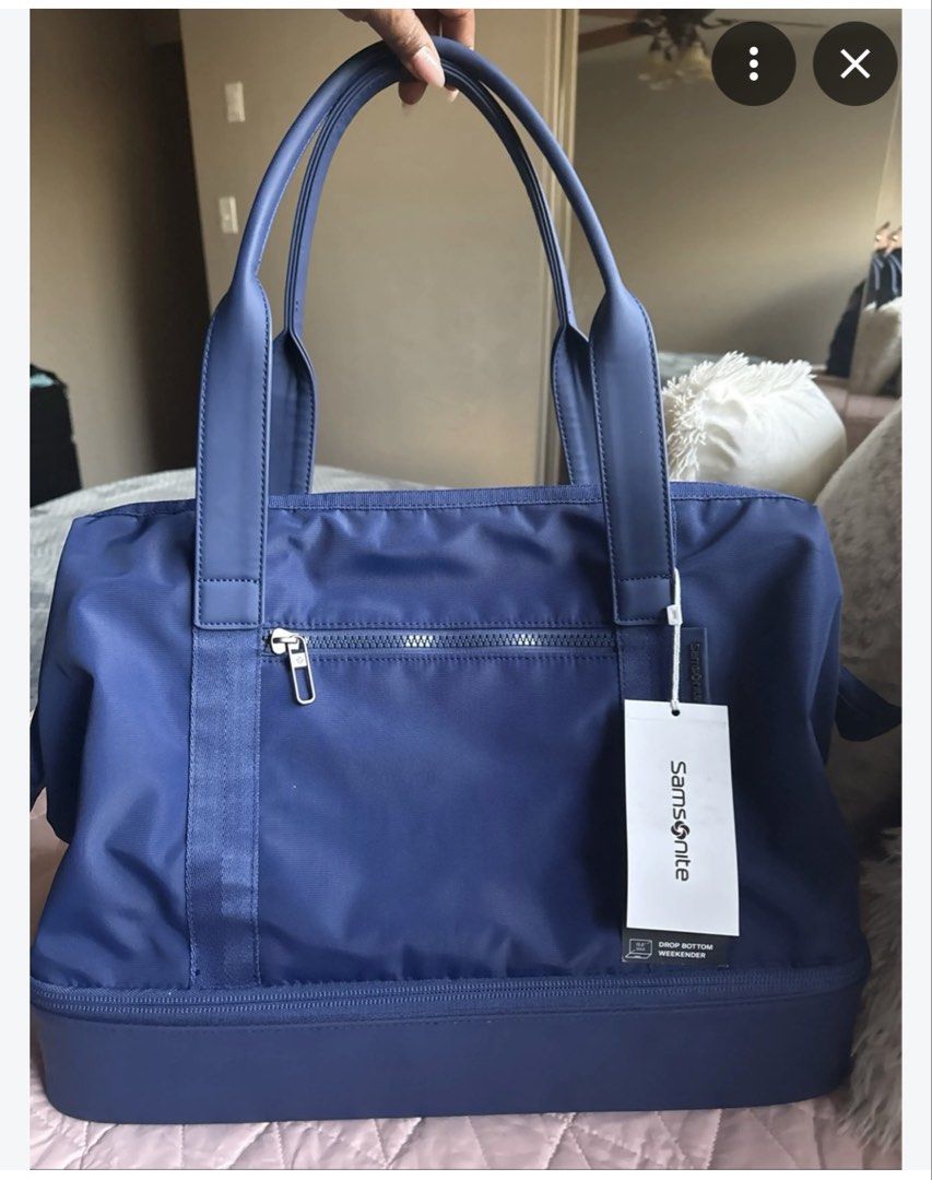 Samsonite Drop Bottom Weekender Bag Blue (Category: Sling Bags) located in Quezon City. Submitted by jamboreeee (Listing ID 1467074143, Image 1). Description: - Brand new removed tags - Vibrant blue color and durable nylon material built for travel - Drop-bottom compartment for extra packing space - Convenient dual top carry handles and included shoulder strap - Front zipper pocket for quick-access items SRP is 60$.