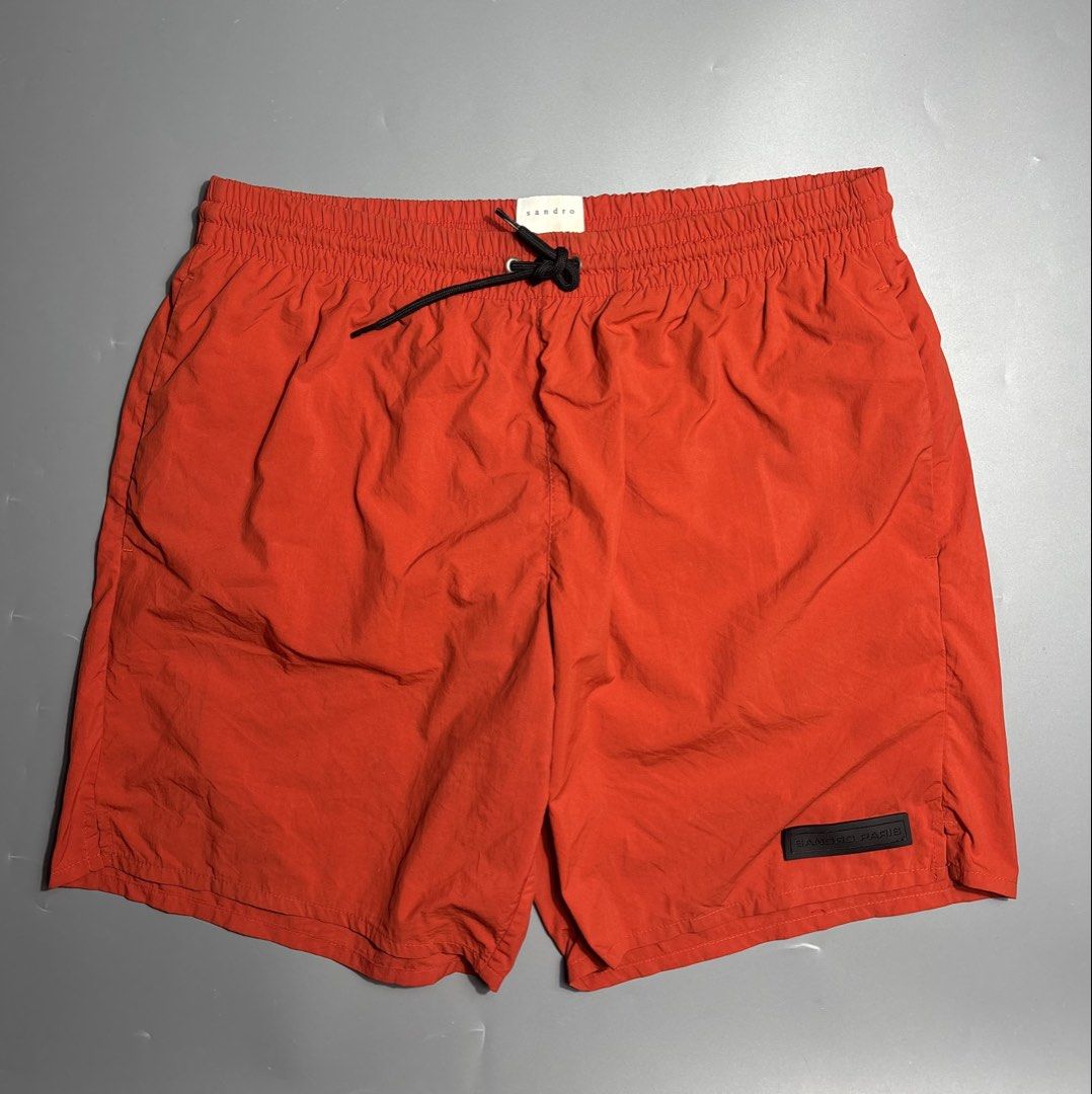 Sandro Paris Nylon Shorts (Category: Swim Trunks & Board Shorts) located in Manila. Submitted by south_finds (Listing ID 1467093769, Image 1). Description: - Brand: Sandro Paris - Color: Bright red - Waistband: Elastic with black adjustable drawstring and metal aglets - Details: Rubberized Sandro Paris logo patch near left hem - Lining: Built-in interior mesh - Reference: Model P6494S-51 - Condition: Excellent / Like new.