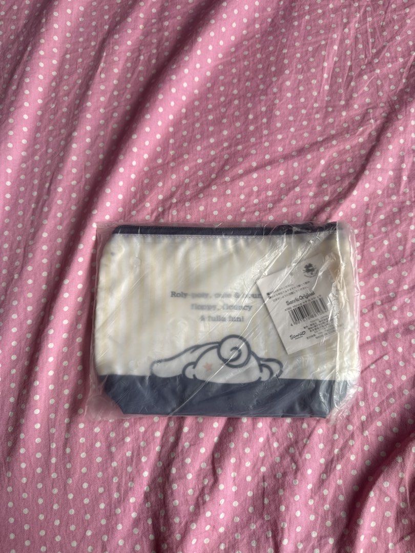 Sanrio Cinnamoroll Pouch Bag (Category: Purses & Pouches) located in Manila. Submitted by gkamille01 (Listing ID 1467012638, Image 2). Description: - 100% Original Sanrio Cinnamoroll merchandise - Brand new, still in original plastic packaging with tags attached - Design: Cream and navy stripes with Cinnamoroll and cute bear graphic - Quote: "Cinnamoroll a warm heart and a wagging tail" - Closure: Top zipper - Perfect size for makeup, stationery,