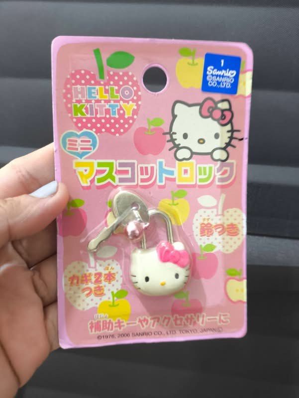 Sanrio Hello Kitty Mini Mascot Lock with Keys (Category: Character Goods) located in Manila. Submitted by janetecson05 (Listing ID 1467059102, Image 1). Description: - Official Sanrio item from 2006 - Brand new and unopened on original pink backing card - Features adorable Kitty face with a pink bow - Includes two matching keys - Comes with a cute tiny bell charm attached to the keyring - Perfect collectible piece for Kitty and Sanrio fans.
