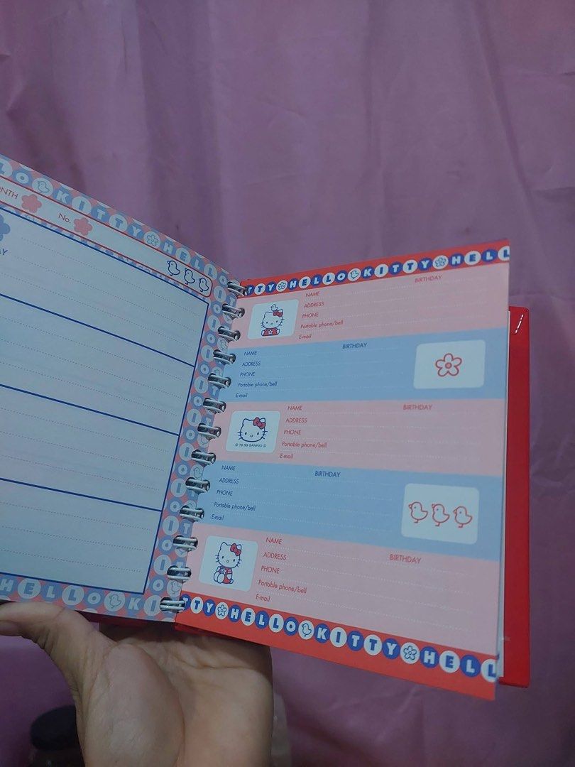 Sanrio Hello Kitty Spiral Notebook Planner (Category: Stationery & School Supplies) located in Manila. Submitted by janetecson05 (Listing ID 1467005702, Image 2). Description: - Authentic Kitty red spiral notebook with adorable plush fuzzy face and bow on the cover - Brand new and 100% unused, absolutely no writing inside - Interior includes calendar layouts, contact info sections, and cute lined pages with pastel Kitty borders - Durable side twi