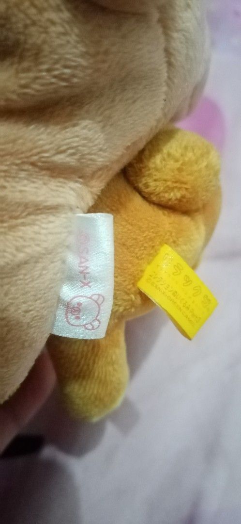 San-x Rilakkuma Plush Toy Set (Category: Plushies & Soft Toys) located in Bulacan. Submitted by renasophiatoystore2020 (Listing ID 1467102912, Image 2). Description: - Authentic San-x Rilakkuma plush set of 2 - Includes: 1 larger light brown bear and 1 smaller dark brown bear with a yellow food item - Condition: Clean overall, super soft fabric - Authenticity: Original white and yellow San-x tags attached - Perfect for San-x collectors and Rilakk
