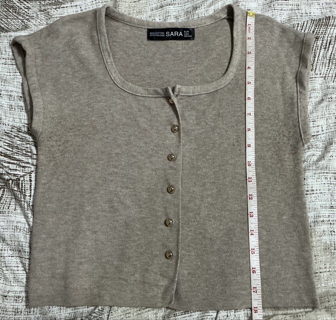 SARA Knit Button-Up Top Brown (Category: Blouses) located in Quezon City. Submitted by cleaningmomma (Listing ID 1467060326, Image 3). Description: - Brand: SARA - Color: Brown - Material: 80% Cotton, 20% Viscose (soft ribbed texture) - Design: Scoop neckline with gold-tone front buttons - Condition: Excellent -Measurements Chest - 16inch Length - 18inch FOR SURE BUYERS PLEASE PROVIDE: (For Waybill) Complete Name Contact number Complete Address (