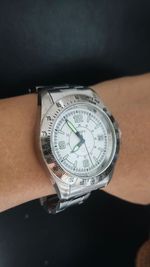 Script White Dial Luminous hands Big face Mens Watch Japan (Category: Men's Watches) located in Taguig. Submitted by mercyeugen28914 (Listing ID 1467094908, Image 3). Description: - Brand: Script wristwatch - Dial: White with bold numbers at 6, 9, and 12 - Bezel: Tachymeter bezel - Date: Convenient date window at the 3 o'clock position - Strap: Silver stainless steel link bracelet with a secure fold-over clasp - Condition: Shows normal wear on th