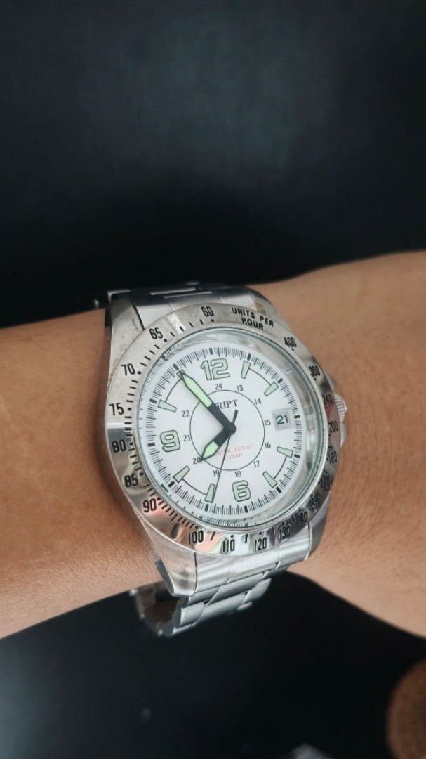 Script White Dial Luminous hands Big face Mens Watch Japan (Category: Men's Watches) located in Taguig. Submitted by mercyeugen28914 (Listing ID 1467094908, Image 1). Description: - Brand: Script wristwatch - Dial: White with bold numbers at 6, 9, and 12 - Bezel: Tachymeter bezel - Date: Convenient date window at the 3 o'clock position - Strap: Silver stainless steel link bracelet with a secure fold-over clasp - Condition: Shows normal wear on th
