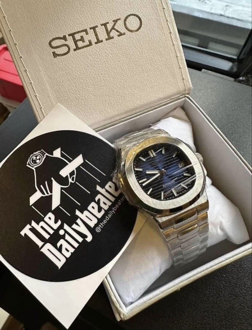 Seiko Nautilus Mod Automatic Blue Dial Steel Watch (Category: Men's Watches) located in Mandaluyong City. Submitted by hansimperial (Listing ID 1467158716, Image 1). Description: - Model: Seiko Custom Mod Automatic Watch - Case: Nautilus style design - Dial: Deep blue horizontal gradient with silver indices and 3 o'clock date window - Bracelet: Stainless steel integrated bracelet with brushed and polished links - Condition: Worn a few times, keep