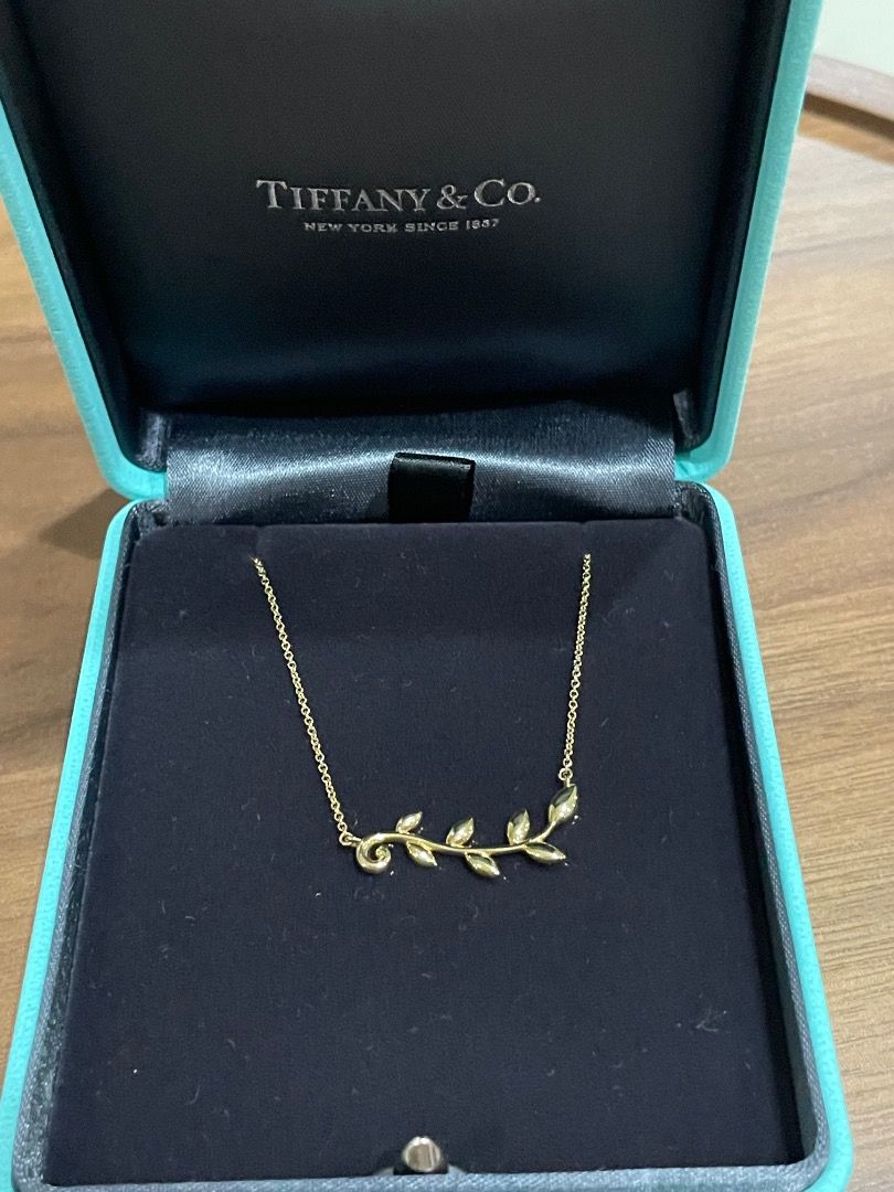 Authentic Tiffany and co. Set earring and necklace (Category: Luxury Accessories) located in Quezon City. Submitted by yenggaytot76 (Listing ID 1467099547, Image 3). Description: - Complete matching jewellery set: 1 necklace and 2 climber earrings - Design: Sparkling 18k yellow gold Paloma Picasso olive leaf climber earrings and necklace - Packaging: Includes original tiffany branded box with pouch and paper bag - Condition: Clean, flawless with 