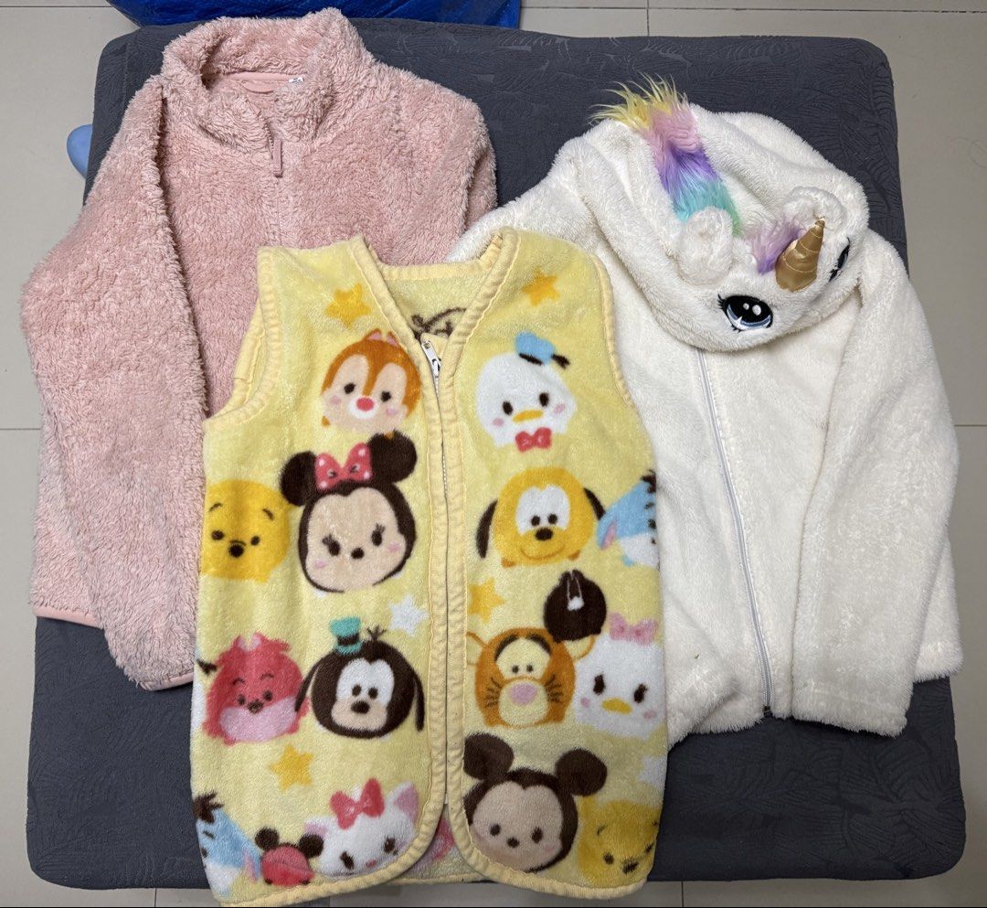 Set of 3 winter jackets (Category: Babies & Kids Fashion) located in Quezon City. Submitted by jamboreeee (Listing ID 1467066168, Image 1). Description: 1. Disney Tsum Tsum vest ( soft fleece) 2. Uniqlo soft fleece punk jacket size 140 ( kindly check minor flaw- bot sure if removable stain sa back sleeves) 3. H&M soft fleece Unicorn hoodie jacket 8-10y like new All are in VGUC condition Best fits 7yo -10y Take all for 800 .