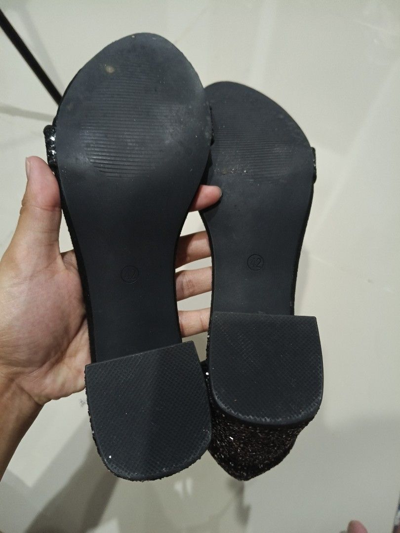 Shein Black Glitter Block Heel Sandals (Category: Heels) located in Makati City. Submitted by maymay829 (Listing ID 1467108866, Image 3). Description: - Color/Finish: Black with dark glitter - Size: 42 - Design: Glitter toe strap and ankle strap with a gold charm buckle - Heel: Chunky block heel for added stability and comfort .